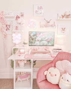 a pink chair sitting in front of a computer desk