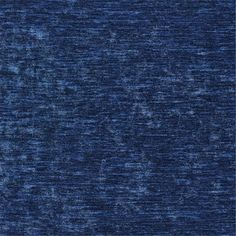 a blue velvet textured upholstered fabric with very thin lines and spots on the surface