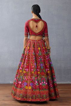 Red attached cancan lehenga with floral print and side pompom tasseles. Paired with a floral print blouse with a heart cutout tasseled back and cutwork embroidered tasseled dupatta. - Aza Fashions Red Floral Embroidered Sets For Navratri, Red Sets With Floral Embroidery For Navratri, Red Anarkali Lehenga With Floral Embroidery, Red Bohemian Lehenga With Traditional Drape, Bohemian Red Lehenga With Traditional Drape, Red Floral Embroidered Sharara For Festivals, Red Floral Embroidery Sharara For Festivals, Fitted Red Bohemian Sharara, Red Fitted Bohemian Sharara