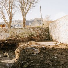 the back yard has been dug up and is ready to be used as a fire pit