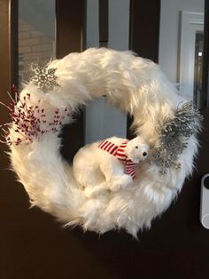 a white wreath with a polar bear on it