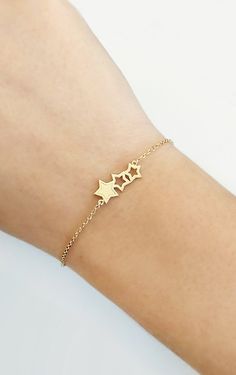 14K Gold Triple Star Bracelet, Solid gold bracelet, Dainty gold bracelet, Wish star bracelet, Gift for her, Stars bracelet, Rose Gold bracelet, 9K Gold bracelet, Delicate gold bracelet Beautiful and delicate bracelet with a triple star charm made in 14K or 9K solid gold. Remember to reach for the stars, and they won't be able to resist flying into your hands! Whsiper...Make a wish! -------------------------------------------------- D E T A I L S 14K Solid Gold or 9K Solid Gold Charm dimensions: 14k Gold Star Charm Bracelet, Gold Bracelet With Star Charm For Gift, Gold Bracelet With Star Charm As Gift, 14k Gold Bracelets With Star Charm, Gold Bracelets With Star Charm For Gift, Gold Star Chain Bracelet As Gift, 14k Gold Bracelet With Star Charm, Gold Star-shaped Bracelet As Gift, Yellow Gold Star Bracelet As Gift