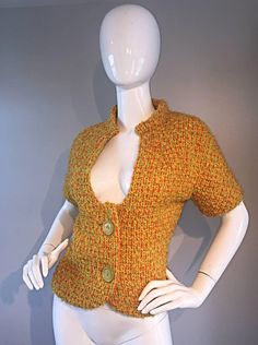 For Sale on 1stDibs - Wonderful 1960s B.H WRAGGE burnt orange boucle short sleeve jacket! Mod style, with an Avant Garde cut-out at the bodice. Two oversized buttons down the Fitted Retro Wool Top, Retro Fitted Wool Top, Fitted Wool Retro Tops, 60s Retro, Retro Jacket, Short Sleeve Jacket, Mod Style, Mod Fashion, Sleeve Jacket