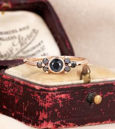 Vintage Art Deco Onyx Engagement Ring | Round Cluster Black Diamond ring | Prong set ring | 14K/18K Solid Gold Ring | Anniversary Ring Years of love story: https://www.etsy.com/shop/GemsOdes 「Product Summary」 ◆Detail description◆ Engagement Ring: -Center Stone: 4mm Round cut Onyx（about0.2ct） -Accent Stone:2mm Round cut Black Diamond*6（about0.21ct） -Shank：1.2mm*1.2mm -Total Weight: about 1.7 g ◆Made of 14k /18k - Rose / White / Yellow Gold ◆All sizes are available, contact me if they do not conta Onyx Engagement Ring, Engagement Ring Round, Solid Gold Ring, Black Diamond Ring, Engagement Rings Round, Set Ring, Rose Gold Engagement, Solid Gold Rings, Moissanite Wedding Bands