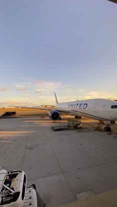 an airplane is parked on the tarmac