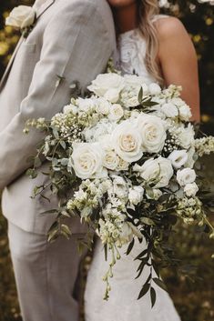 boutonniere, eucalyptus, wedding bouquet, bridal bouquet, white bridal bouquet, white wedding bouquet, playa blanca rose, white rose, lisianthus, larkspur, spray rose, babies breath, all-white wedding, wedding flowers, Italian ruscus, gunni eucalyptus, intimate wedding, backyard wedding, summer wedding, romantic wedding, white wedding, J.Blu Design Wedding and Event Florist in Peoria, Illinois wedding, central Illinois wedding, midwest wedding, Always Flourishing Photography, wedding florist Cascade Bridal Bouquet, Bride Bouquets White, White Flower Bouquet, White Rose Bouquet, Greenery Bouquet, White Roses Wedding, Casablanca Bridal, Wedding Bouquets Bride