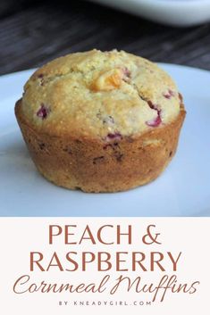 peach and raspberry cornmeal muffins on a white plate with the words, peach and raspberry cornmeal muffins