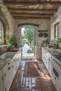 an open door leading to a kitchen with white cabinets