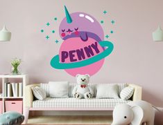 a wall decal that says penny with an image of a unicorn in the background