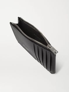 SAINT LAURENT's holder is a sleek way to keep your business and credit cards in check. Crafted from pebble-grain leather and fitted with a zipped pocket for coins, it is an everyday essential. Modern Coin Purse With Rfid Blocking For Business, Leather Coin Purse With Interior Card Slots For Business, Modern Leather Card Holder With Zipper, Modern Leather Coin Purse For Business, Modern Leather Card Holder With Zipper Closure, Modern Business Coin Purse With Rfid Blocking, Modern Business Card Holder With Zipper Closure, Designer Leather Coin Purse With Card Slots, Modern Formal Coin Purse With Card Slots