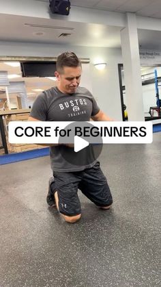 a man in grey shirt and black shorts doing exercises on a gym floor with the words core for beginners