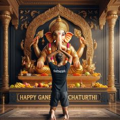 a man standing in front of an elephant statue with the words happy ganesh written on it