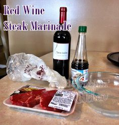 red wine and steak marinade are on the counter