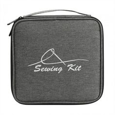 the sewing kit case is grey and has white writing on it that says sewing kit