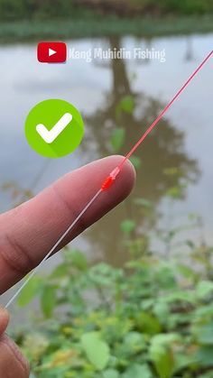 a hand holding a red string with a green check mark on it and an arrow pointing to the right