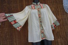 "Beautiful peasant style blouse by Byer. Short sleeves.  Labeled size medium - please see measurements. Good vintage condition.   Measurements taken across front laid flat Bust21\" Shoulder to hem24\" Waist24\"" Traditional Long Sleeve Cream Blouse, Traditional Cream Long Sleeve Top, Traditional Long Sleeve Cream Top, Festival Long Sleeve Cream Blouse, Peasant Blouse With Buttons For Spring, Fall Peasant Blouse With Short Sleeves, Cream Long Sleeve Blouse For Festival, Traditional Cream Blouse For Spring, Cotton Peasant Blouse With Boho Collar