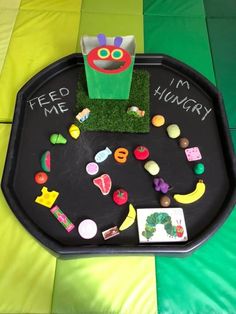 the very hungry caterpillar tray is decorated with magnets