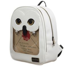 a white backpack with an owl face on it