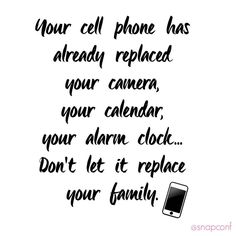 a cell phone sitting on top of a white wall next to a black and white quote