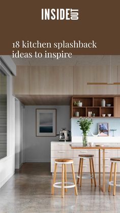 a kitchen with wooden cabinets and stools next to a counter top in the middle