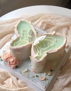 there is a cake that looks like two butterflies on it