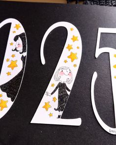 a black and white sign with the number twenty two in it's center surrounded by stars