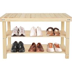 wooden shoe rack with four pairs of shoes on it