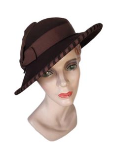 Elegant edged brown felt hat, Made in the U.S.A. by Merrimac. Walk in style with this original.  Condition is very good. Hat can fit many sizes Perfect hat for every occasion.  Wedding, Party, Beach, Picnic, Church, from A to Zone hat, a variety of LOOKS! Add sweet day dress and off to the Gatsby you go. HAT BLOCK/MANNEQUIN NOT INCLUDED Buyer pays all related shipping costs, including insurance. All Sales Final Thank you, CityVintage Retro Brown Adjustable Hat, Vintage Fedora With Curved Brim For Fall, Vintage Fitted Hat Bands For Fall, Adjustable Vintage Felt Hat For Fall, Elegant Brown Wool Cloche Hat, Fitted Hat With Short Brim And Lining, Vintage Fur Felt Fedora For Fall, Vintage Wool Cloche Hat For Fall, Vintage Wide Brim Hat For Fall