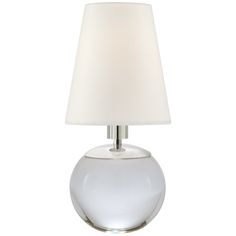 a glass table lamp with a white shade on the base and a light bulb attached to it