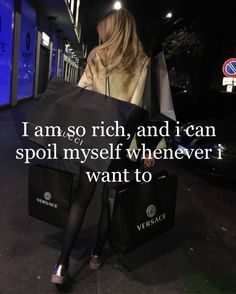 a woman sitting on top of a black bag with the words i am so rich, and i can spoil my self whenever i want to