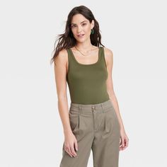 Women's Slim Fit Tank Top - A New Day™ : Target Casual Solid Seamless Tank Top, Casual Seamless Solid Tank Top, Casual Seamless Solid Color Tank Top, Casual Green Scoop Neck Camisole, Casual Green Camisole With Scoop Neck, Spring Scoop Neck Tank Top, Green Scoop Neck Camisole For Spring, Solid Tank Top With Tank Straps For Day Out, Versatile Solid Color Tank Top