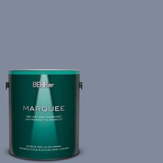 the behr marquee paint is shown in an open, gray tin with a light