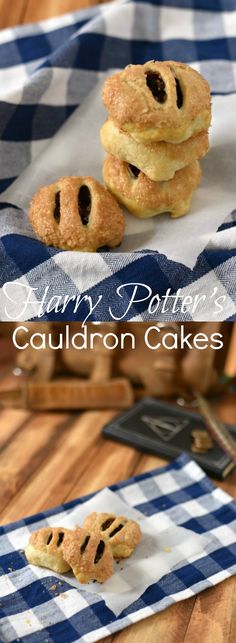 some cookies are sitting on a blue and white checkered table cloth with the words harry potter's cauldron cakes