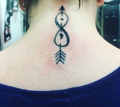 a woman with a black tattoo on her neck and an arrow in the shape of a heart