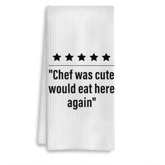 a white towel with black stars on it that says chef was cute would eat here again