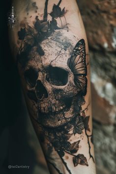 a black and white tattoo with a butterfly on the side of a human skull that is covered in leaves