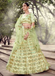 Pista Green Sequence Lehenga Choli Floor-length Green Art Silk Sets, Embroidered Pista Green Sets For Reception, Green Floor-length Art Silk Set, Semi-stitched Pista Green Choli For Eid, Pista Green Floor-length Art Silk Choli, Floor-length Embroidered Pista Green Choli, Pista Green Embroidered Floor-length Choli, Embroidered Pista Green Floor-length Set, Fitted Bollywood Gown In Pista Green