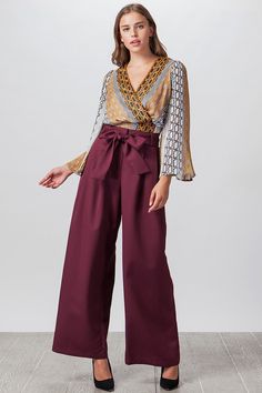 Burgundy Wide Leg Palazzo Pants with Fabric Waist Tie These pants are perfect with a bodysuit and a cardigan! If you are not a fan of bodysuits, you can wear any top! If you can tuck in the top, it would show off the pretty bow or tie from the belt. Model is 5'9" tall, 34" Chest, 25" Waist and 35" Hips and wearing size Small Style No. AP1146-A 100% Polyester Burgundy Plazo Outfits Western Casual, Plazo Outfits, Burgundy Pants Outfit, Cute Professional Outfits, Burgundy Pants, Fashion Top Outfits, Wide Leg Palazzo Pants, Flowy Pants, Pants Large