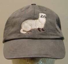 a hat with an embroidered animal on it