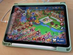 a tablet with a game on it sitting on a table