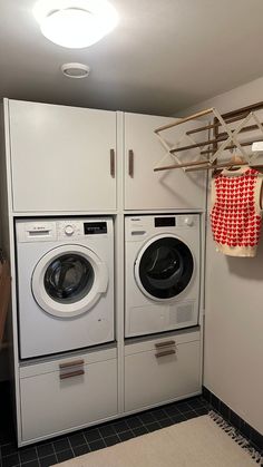 a washer and dryer in a small room