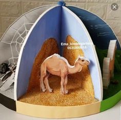 a paper model of a camel in the desert