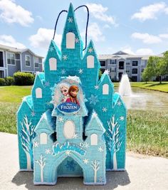 a frozen princess castle is shown on the sidewalk