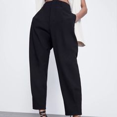 High Waisted Slouchy Dress Pant With Front Pleats At Waist And Ankles Cinched With Darts. Two Belt Loops At Front, Three At Back. Functional Pockets On Each Side & Two Faux Pockets At Back. Zara Art : 2355/034/800 Material Content 74% Polyester 23% Viscose 3% Elastane Casual Zara Pants For Evening, Zara Casual Evening Pants, Elegant Zara Bottoms For Going Out, Elegant Bottoms With Pockets For Going Out, Elegant Pants With Pockets For Going Out, Elegant Going Out Pants With Pockets, Tweed Romper, Peplum Jumpsuits, Embellished Leggings