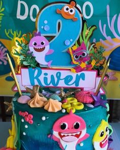 a birthday cake decorated with an ocean theme