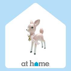 a small toy deer with a bell around its neck on a blue and white background