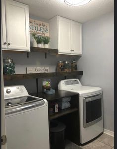 a washer and dryer sitting in a laundry room next to eachother