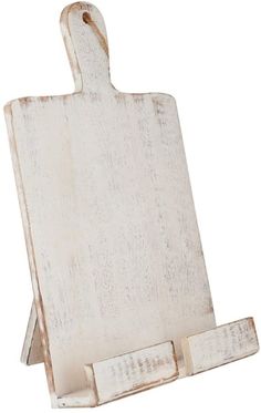 an old white wooden cutting board with handles