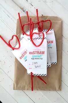 some paper bags are tied together with red string