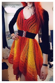 a woman with red hair wearing a dress made out of crochet